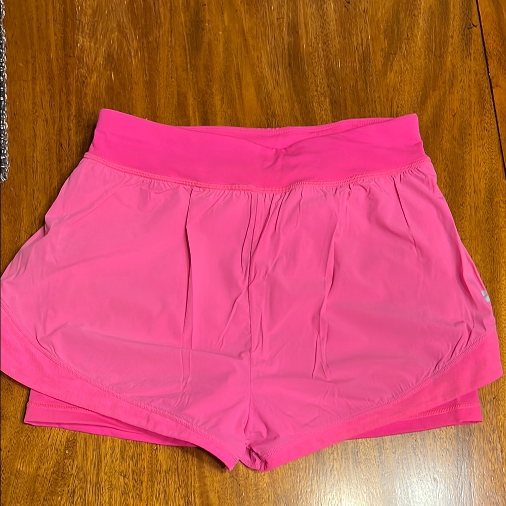 Sweaty Betty Pink Athletic Shorts with Wide Waistband and Curved Hem